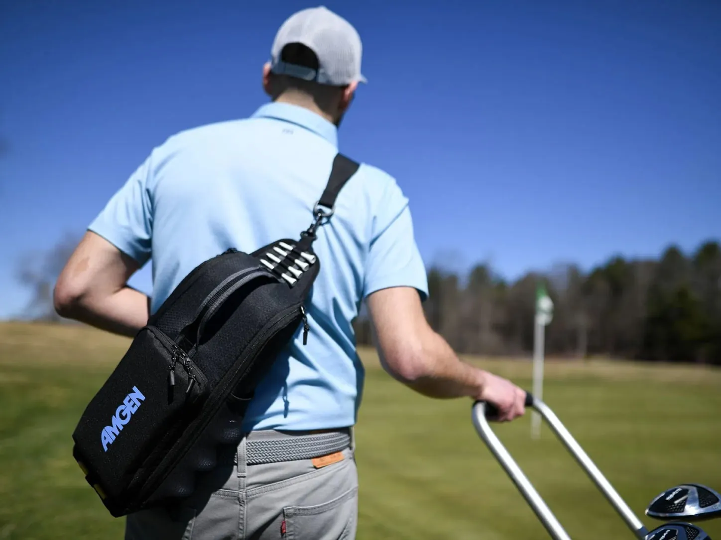 Tall golf speaker in a golf cart on an autumn fairway